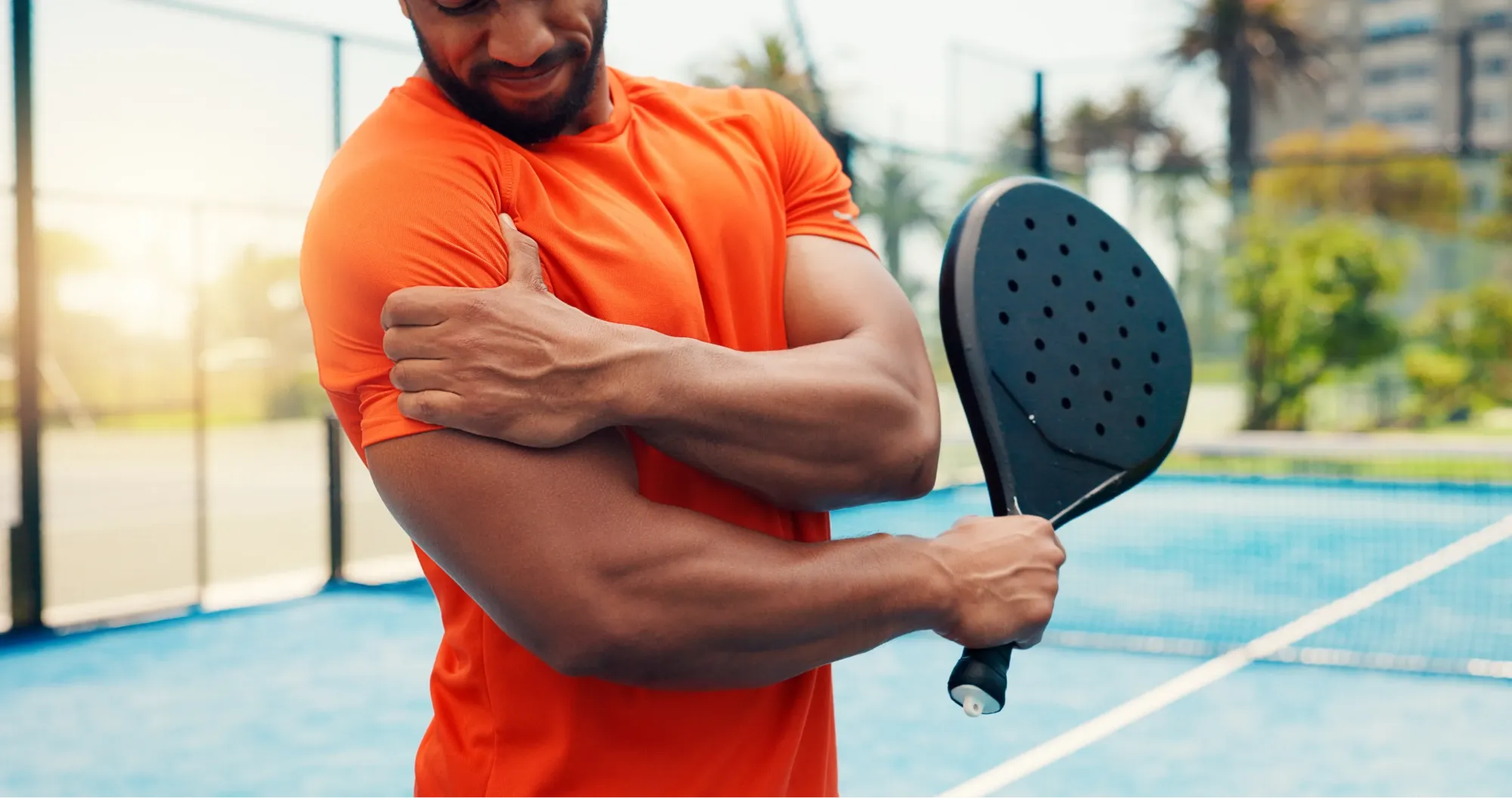 man experiencing shoulder pain due to a SLAP Tear.