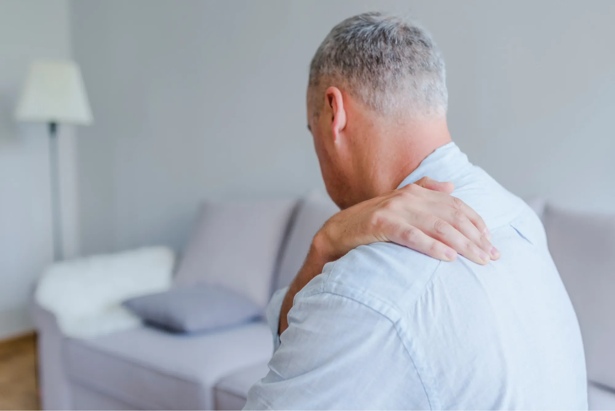 Male patient in need of shoulder replacement surgery for shoulder pain.