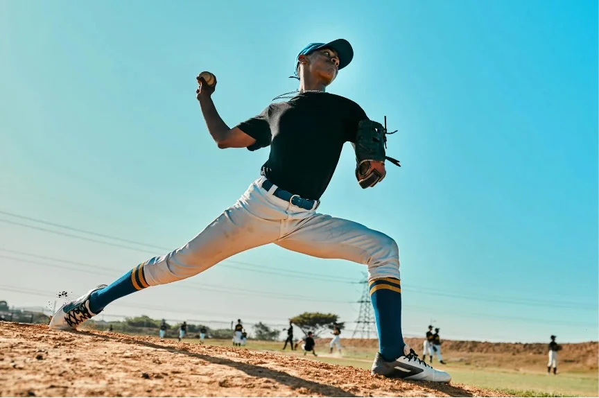 Baseball pitcher mid-throw, an overhead motion that places heavy demand on the biceps tendon at the shoulder